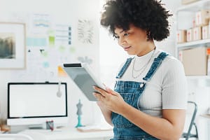 Delivery, ecommerce and tablet with woman in warehouse with business checklist for logistics, online shopping and storag