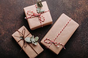 Minimalistic Christmas presents Minimalistic Christmas presents flat lay composition on dark concrete background. Christ