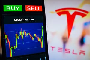July 20, 2022, Brazil. In this photo illustration the stock market graphic seen on a smartphone with the Tesla, Inc. log